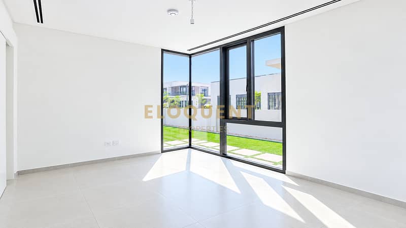6 Sunlit Minimalist Room with Corner Windows. png