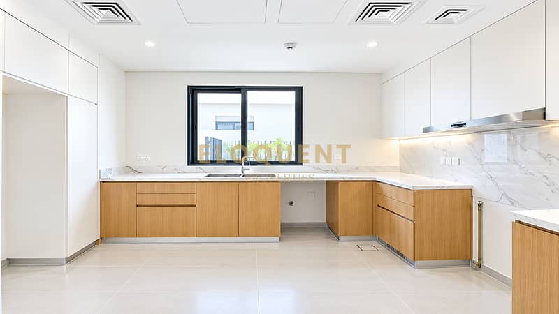 3 Bright Minimalist Oak and Marble Kitchen. png