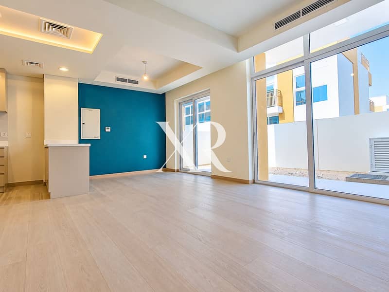 2 Modern Teal-Accent Open-Plan Interior. png