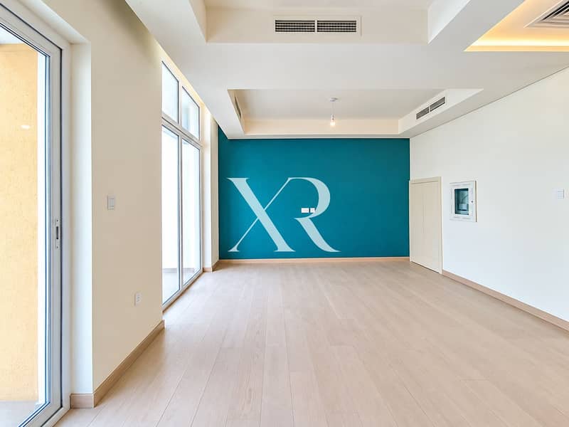3 Bright Minimalist Room with Teal Accent Wall. png