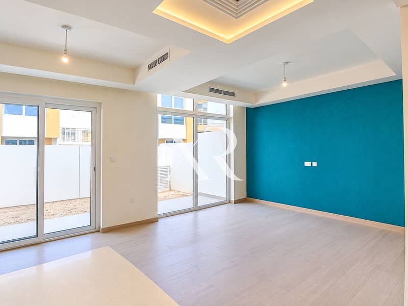 4 Bright Modern Room with Teal Accent Wall. png