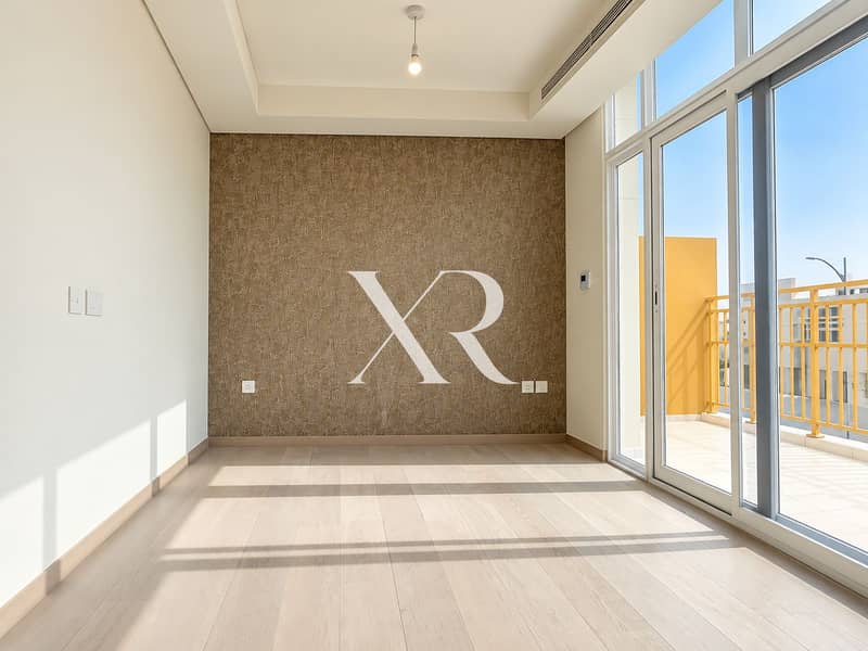 8 Sunlit Minimalist Room with Balcony Views. png