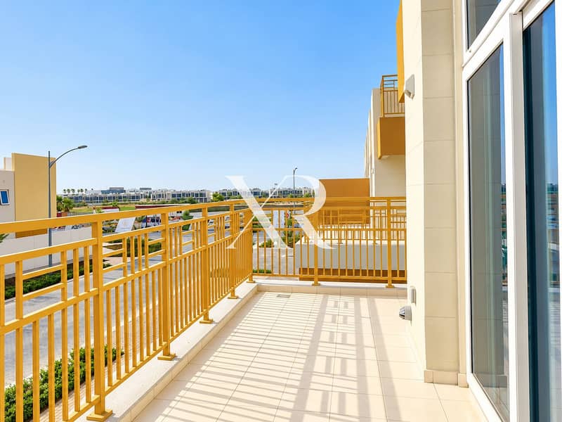 14 Sunlit Modern Balcony with Golden Railings. png