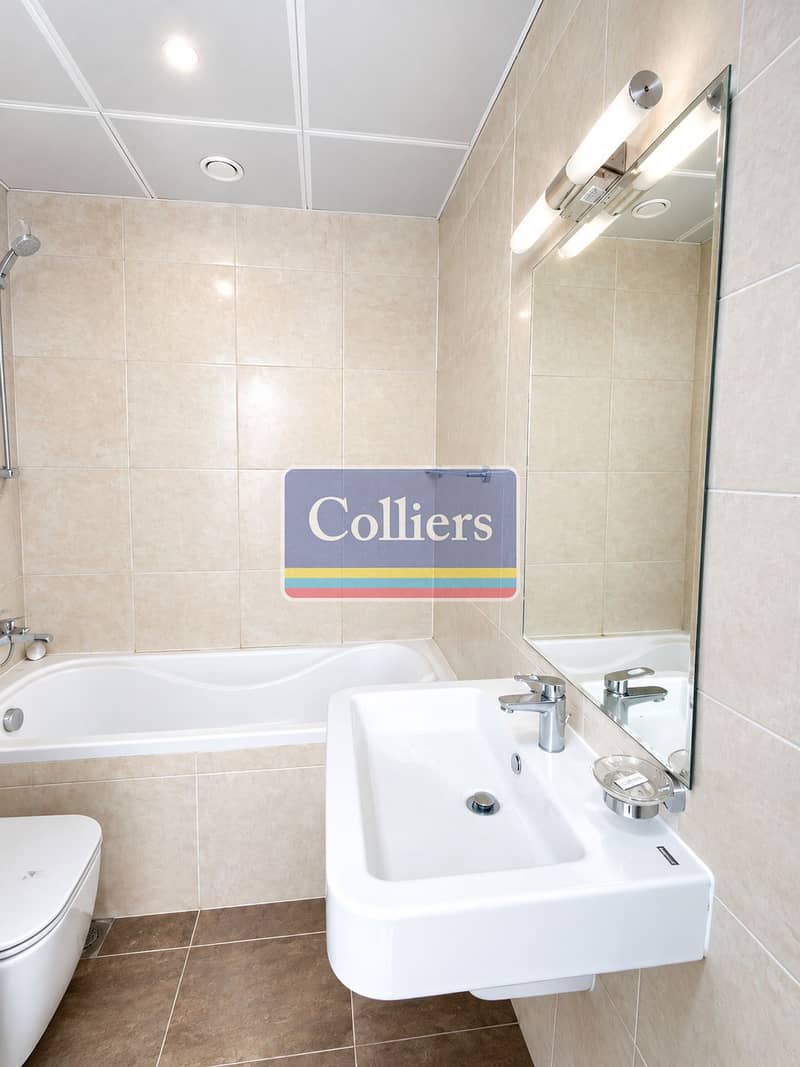 13 Bright Modern Tiled Bathroom. png