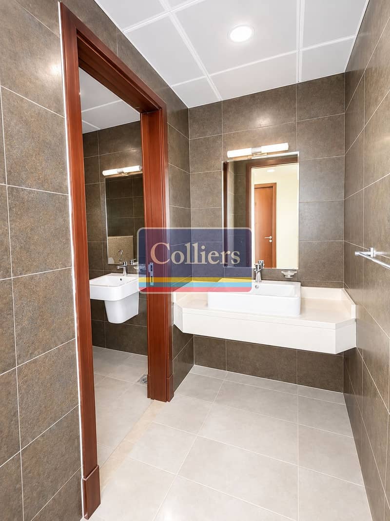 14 Modern Tiled Bathroom with Dual Sinks. png