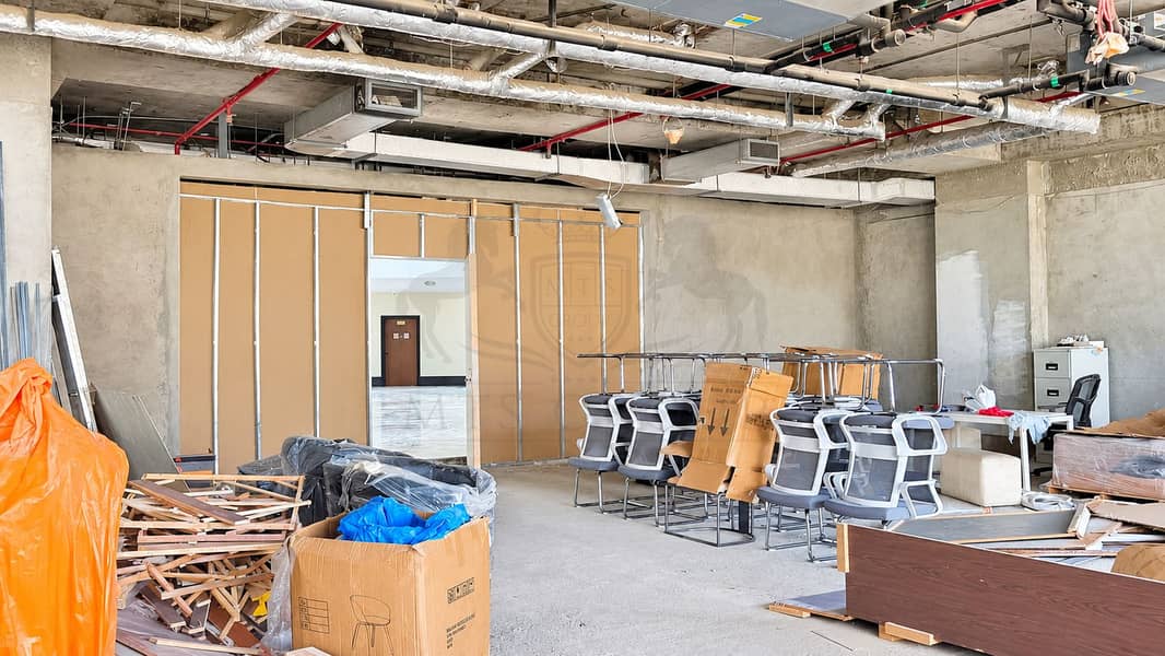 6 Renovation Workspace Beneath Exposed Ducts. png