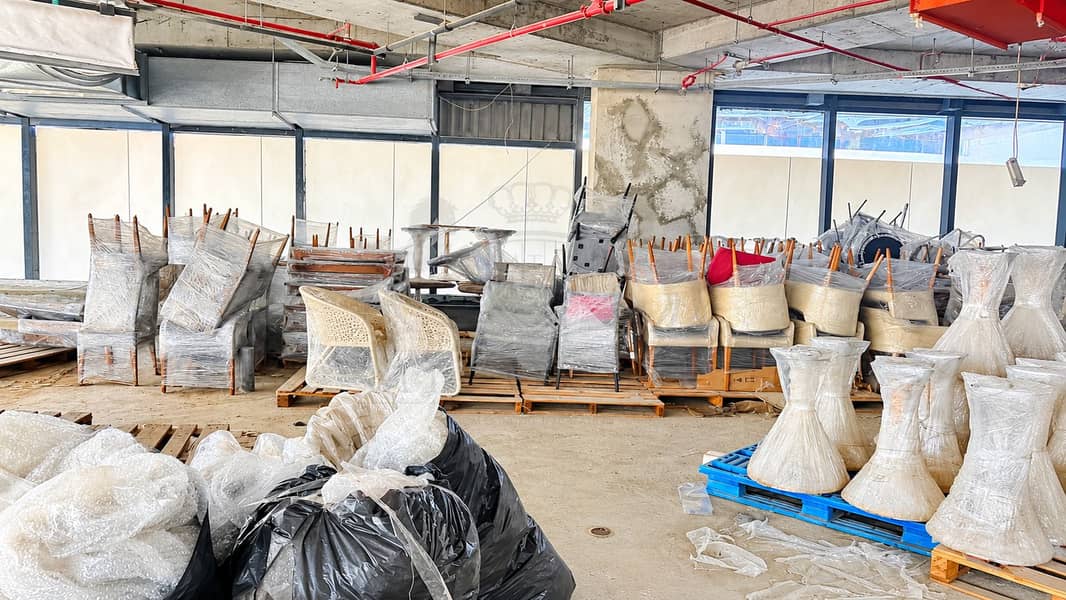 13 Wrapped Furniture in Industrial Warehouse. png