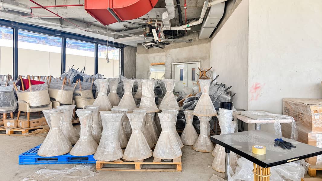 14 Wrapped Furniture in an Industrial Storage Room (1). png