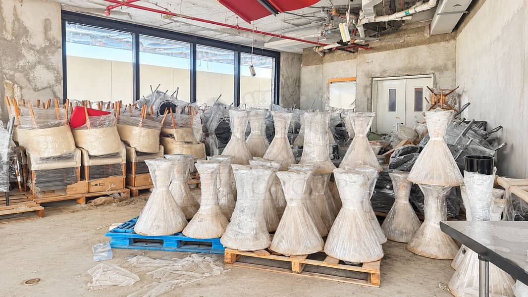 15 Wrapped Furniture in an Unfinished Warehouse. png