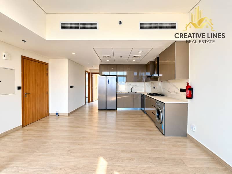 3 Modern Empty Apartment with Glossy Kitchen. png