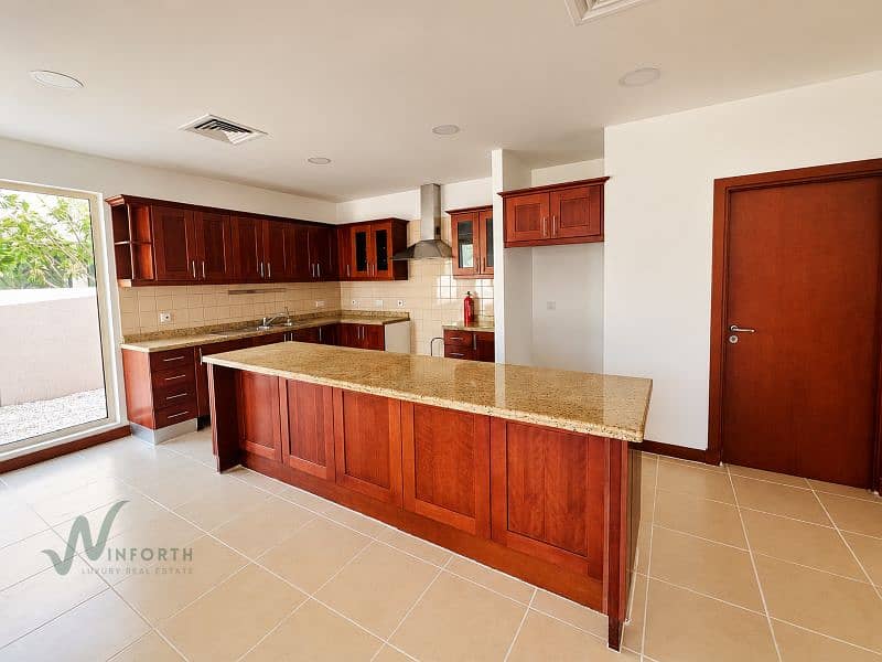 6 Spacious Warm-Toned Kitchen Interior. png
