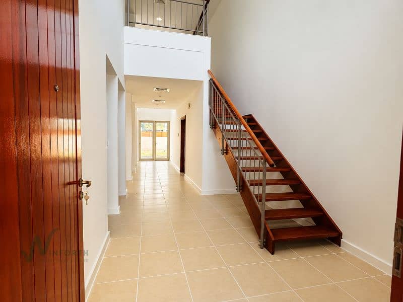 7 Modern Foyer with Staircase and Glass Doors. png