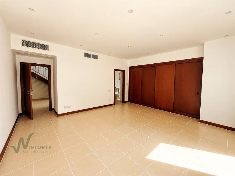 12 Sunlit Minimalist Room with Dark Wood Details. png