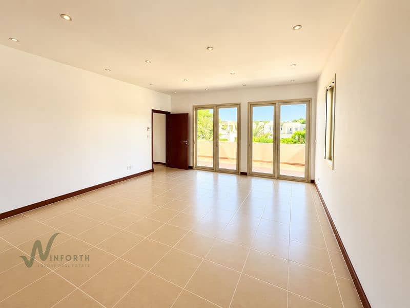 13 Sunlit Minimalist Room with Patio Views. png