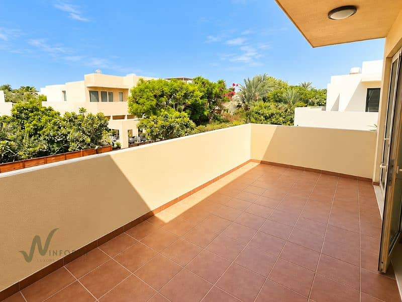 18 Sunlit Terracotta Balcony Overlooking Greenery. png