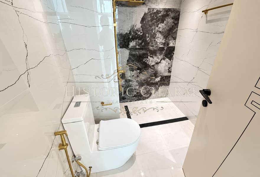 9 Modern Marble Bathroom with Brass Accents (1). png
