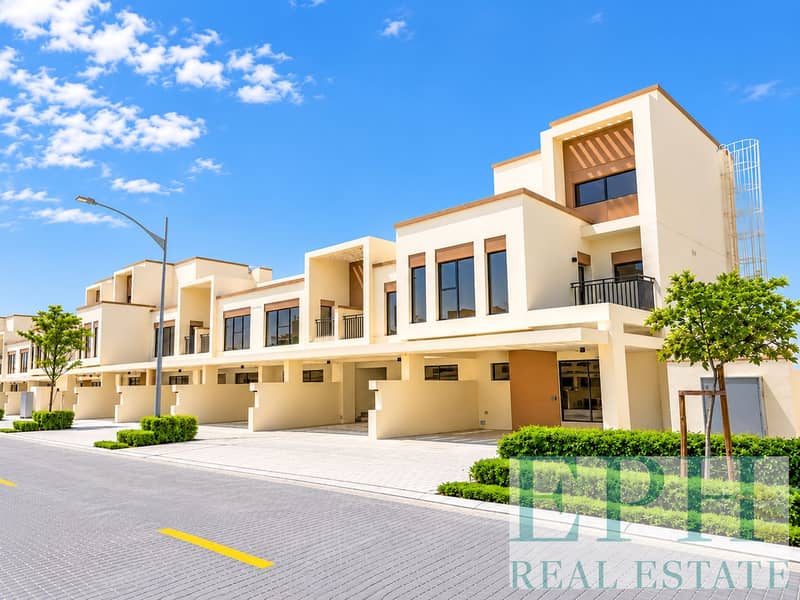 Modern Townhouse Development Under Blue Skies. png Modern Townhouse Development Under Blue Skies. png