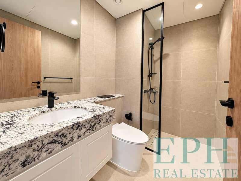 8 Modern Beige-Tiled Bathroom Interior. png