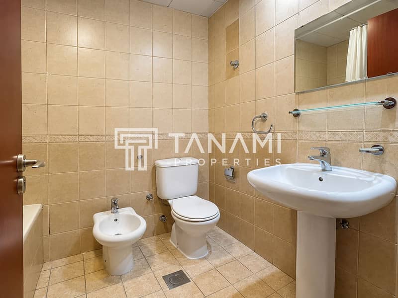 16 Modern Beige-Tiled Bathroom Interior. png