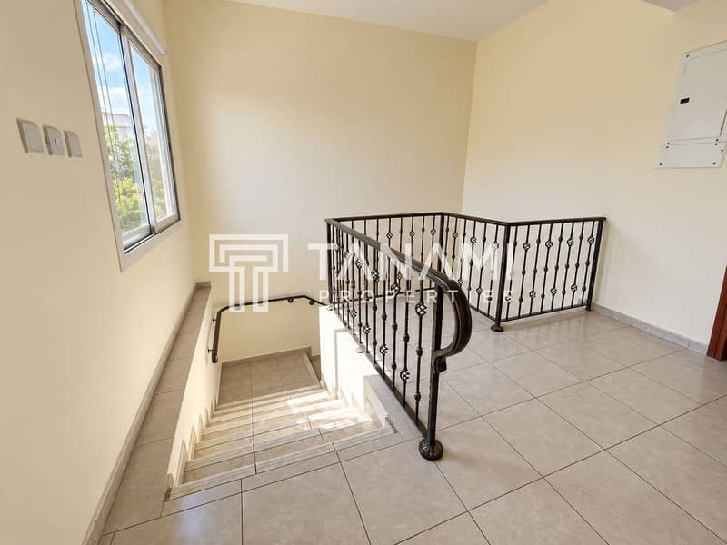 20 Sunlit Loft Landing with Ornate Stair Railing. png