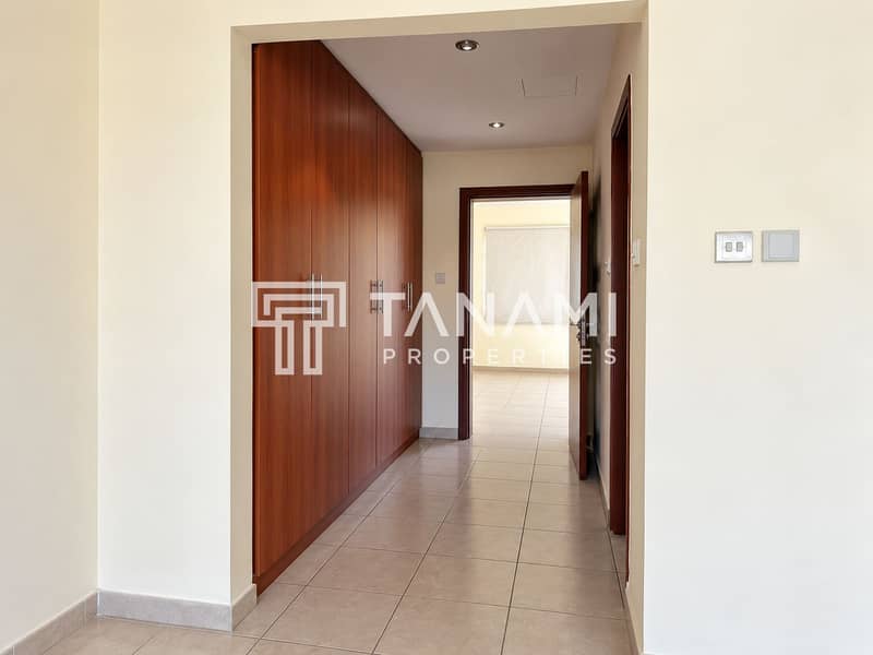 23 Modern Hallway with Cherry Wood Closets. png