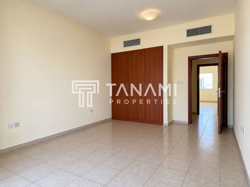 25 Empty Neutral Room with Wooden Wardrobe. png