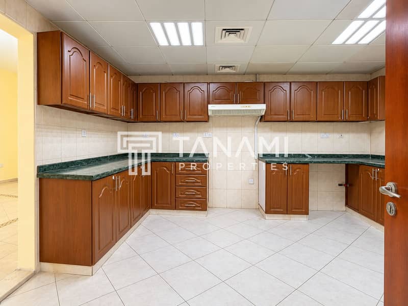 27 Bright Wood-Cabinet Kitchen Interior. png