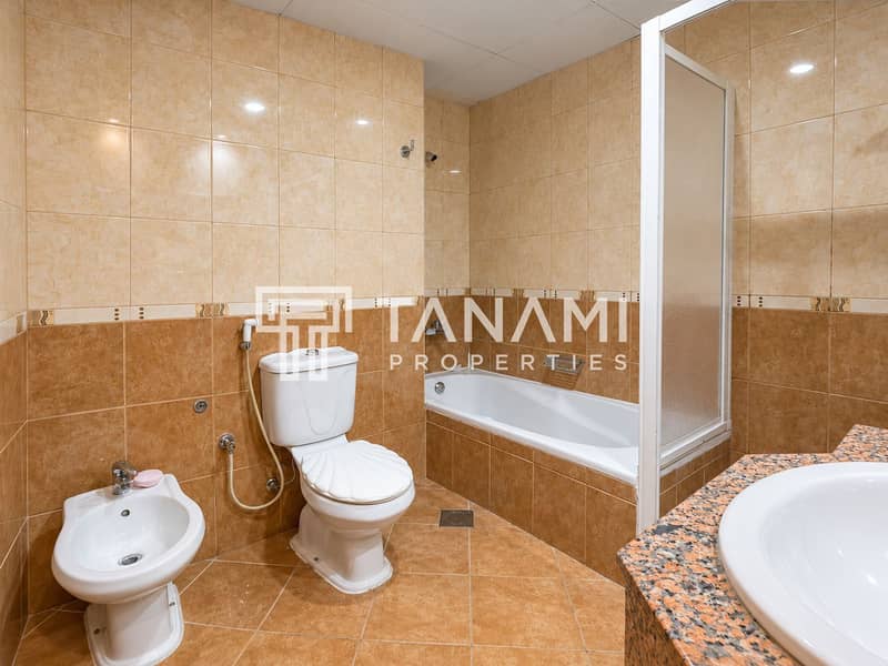 28 Warm Tiled Bathroom Interior. png
