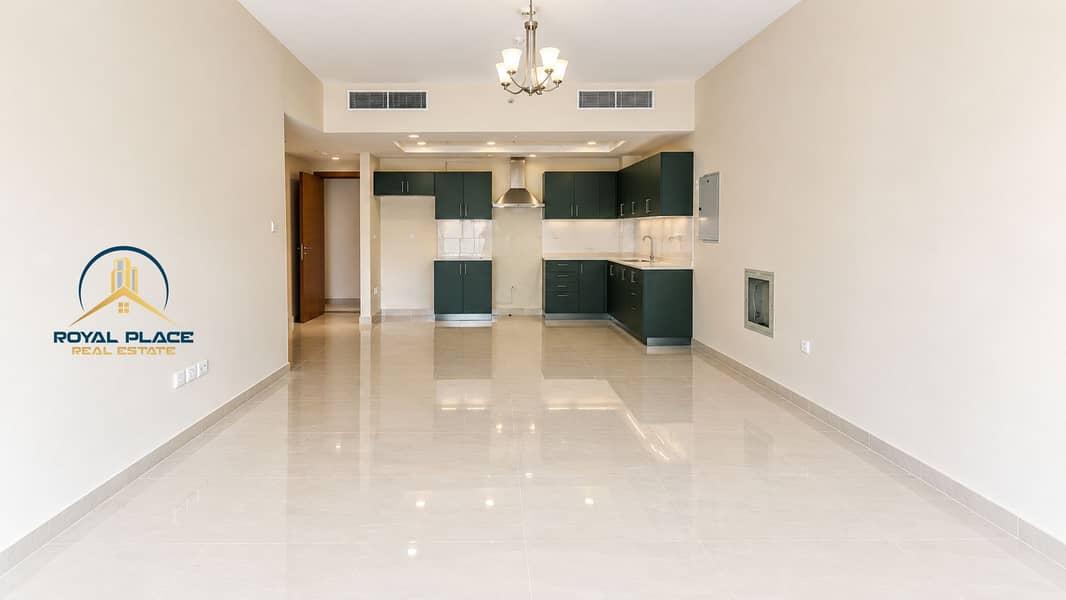 3 Modern Empty Apartment with Teal Kitchen. png
