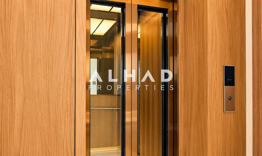 13 Luxurious Wood-Paneled Glass Elevator. png