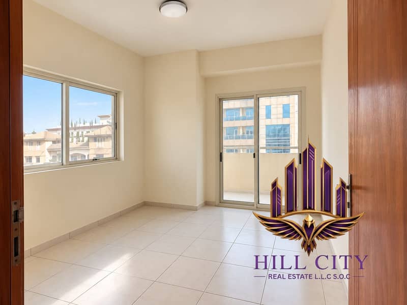 2 Bright apartment interior with balcony access. png