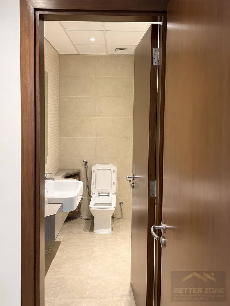 7 Modern Minimalist Bathroom Through Wooden Door. png