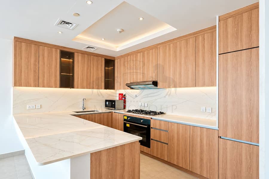 2 Warm Modern Wood and Marble Kitchen. png