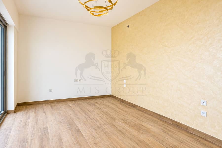 6 Bright Minimalist Room with Gold Chandelier. png
