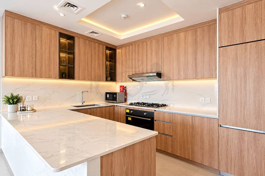 15 Warm Modern Oak and Marble Kitchen. png
