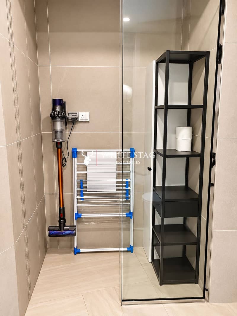 8 Modern Utility Nook with Vacuum and Shelving. png