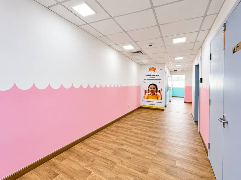 4 Bright Pink-and-White Learning Center Hallway. png