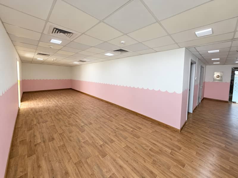 5 Bright Empty Corridor with Pink Scalloped Walls. png