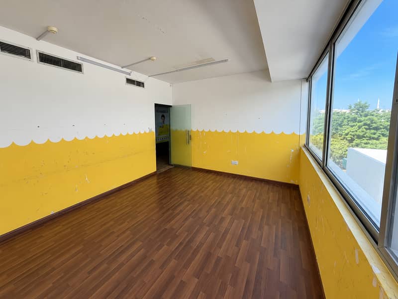 7 Sunlit Classroom with Scalloped Walls. png