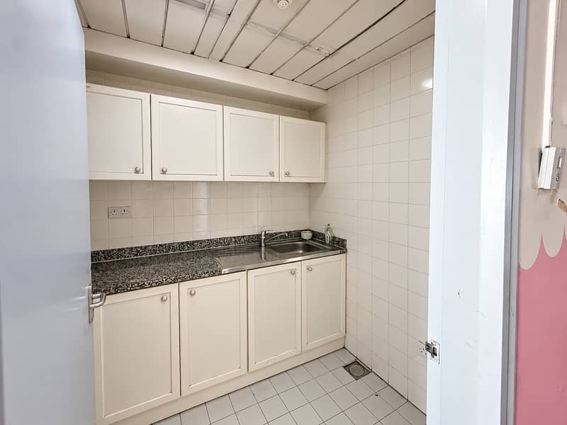 15 Bright Compact Tiled Utility Kitchen. png