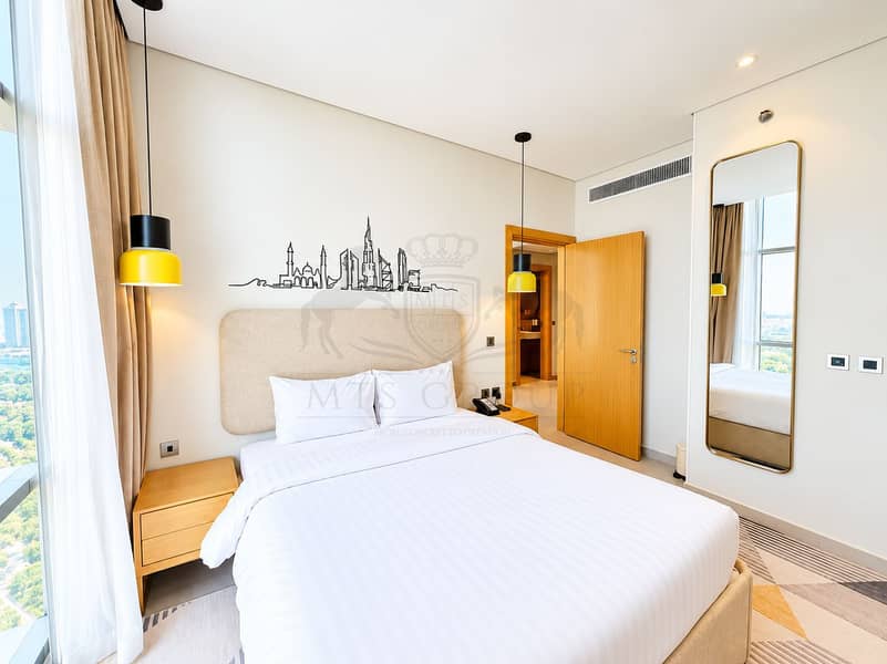 2 Modern Hotel Bedroom with Skyline Mural. png