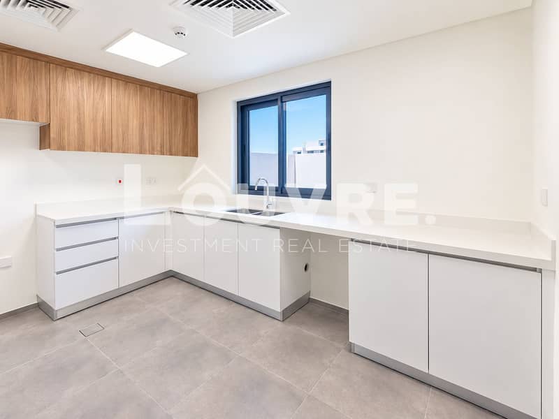 9 Modern Minimalist Kitchen with Rooftop View. png