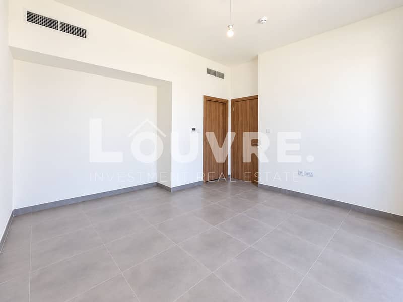 15 Minimalist Room with Gray Tile and Wood Doors. png