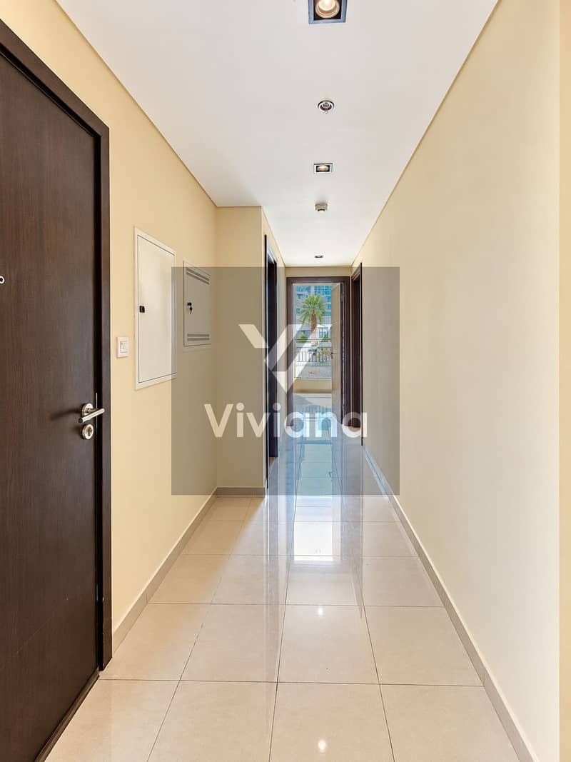 7 Modern Corridor Leading to Sunlit Balcony. png