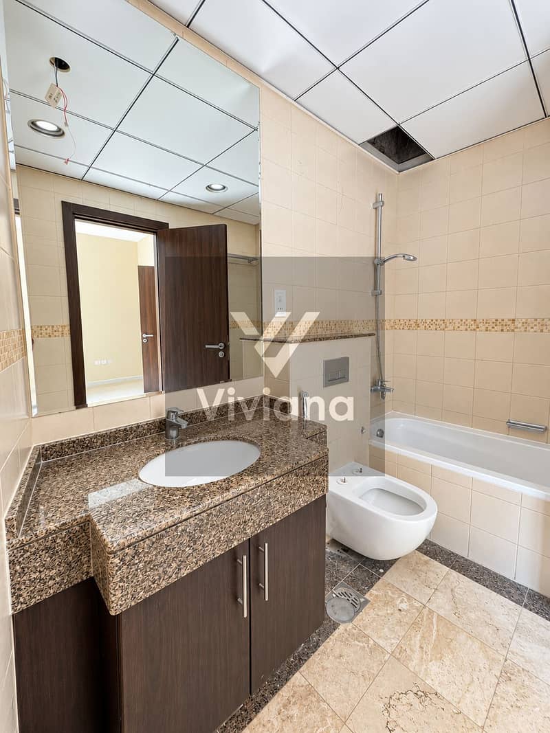 8 Bright Modern Beige Tile Bathroom. png