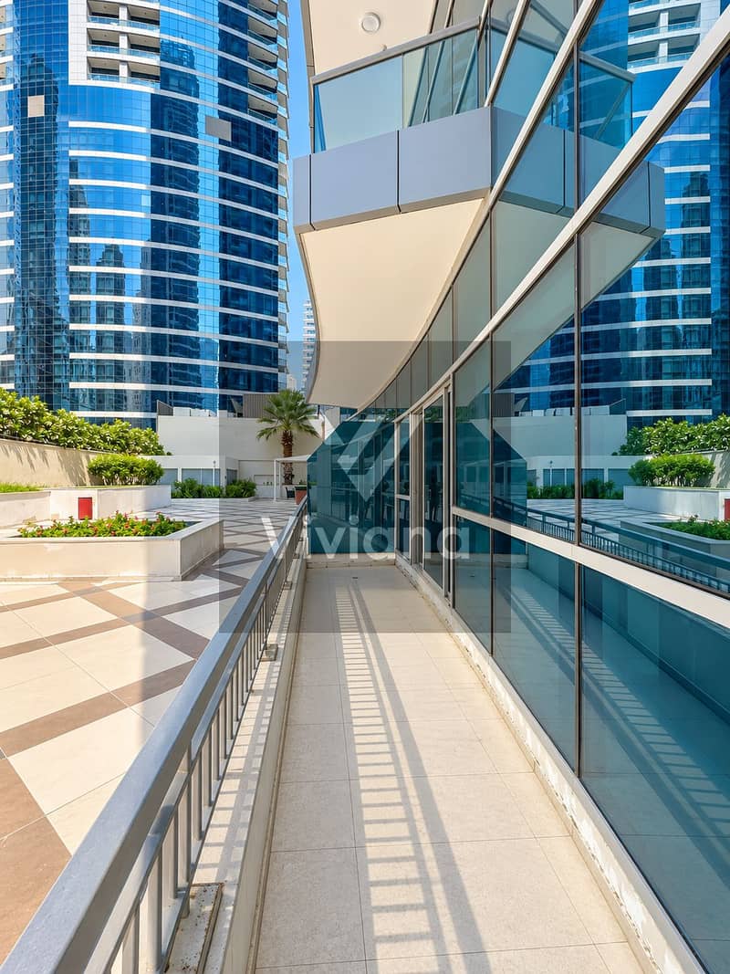 12 Sunlit Modern Glass Courtyard Walkway. png