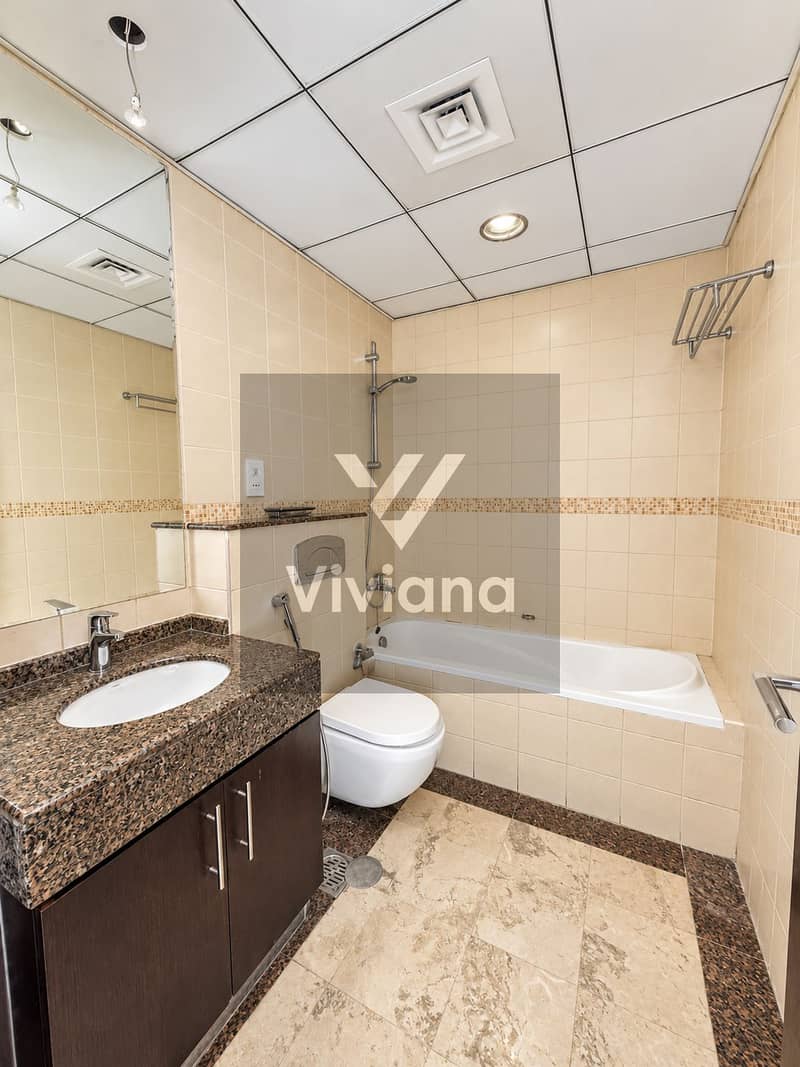 15 Modern Beige-Tiled Bathroom Interior. png