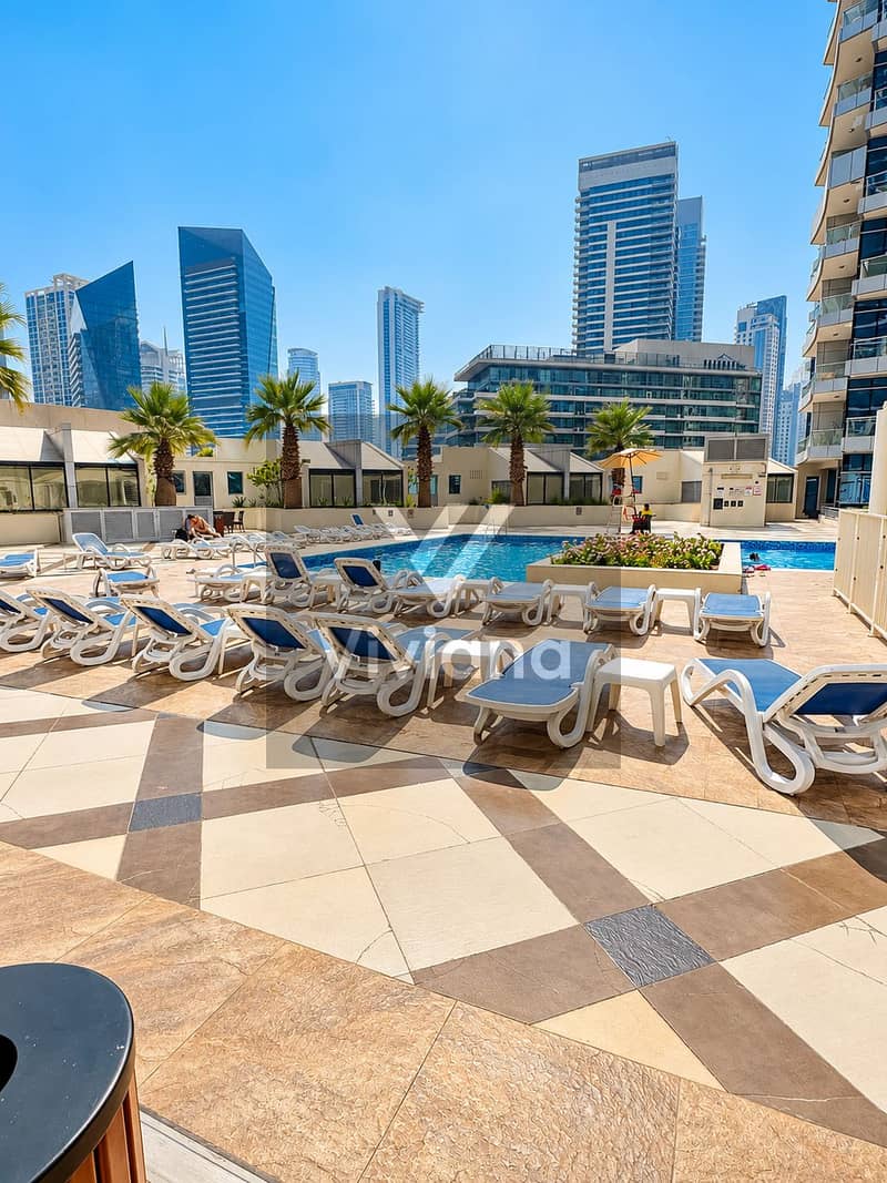 16 Rooftop Pool Deck with City Skyline. png
