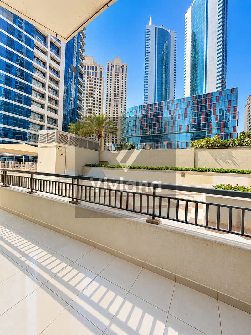 18 Sunlit Balcony Overlooking Modern City Towers. png