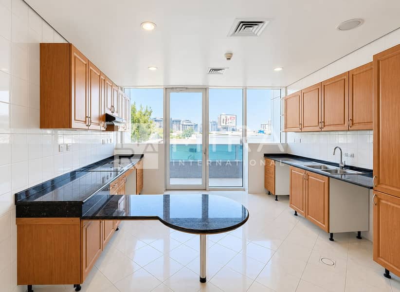 2 Bright Modern Galley Kitchen with Balcony View